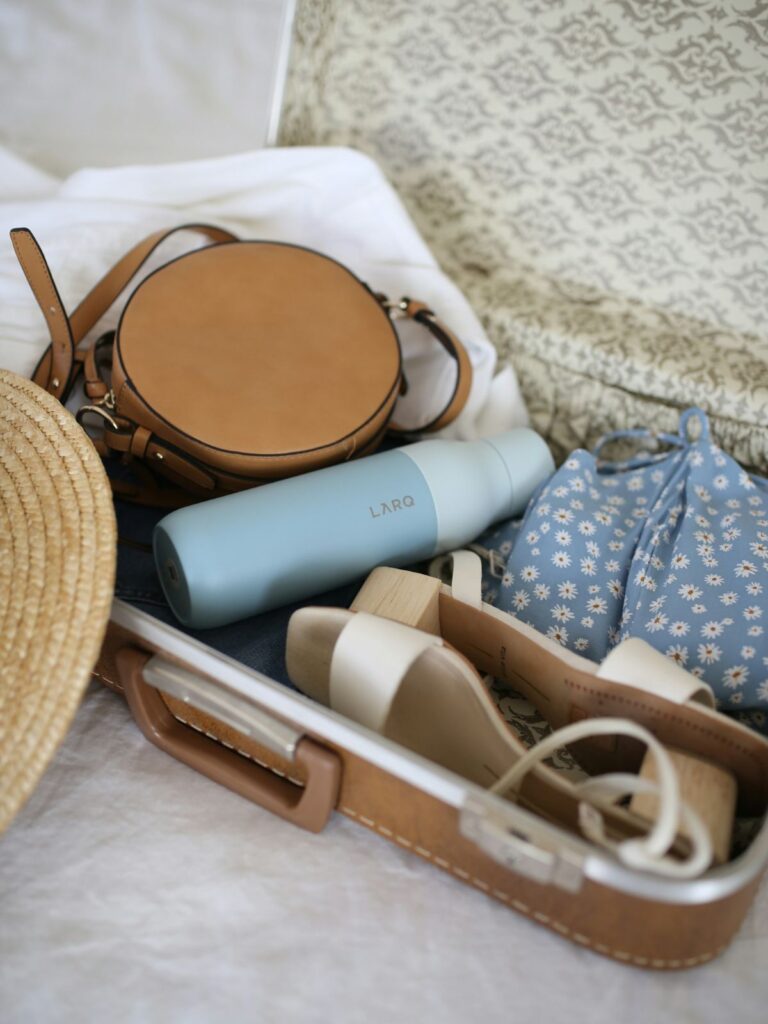 Essential packing lists spark multiple travel post ideas. Here is a suitcase packed with travel needs.