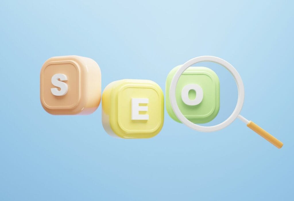 Three tiles. The fist pink on has the letter S on it, the second yellow tile has the letter E on it, and the third green one has the letter O on it. all against a baby blue background with a magnifying glass over the o.